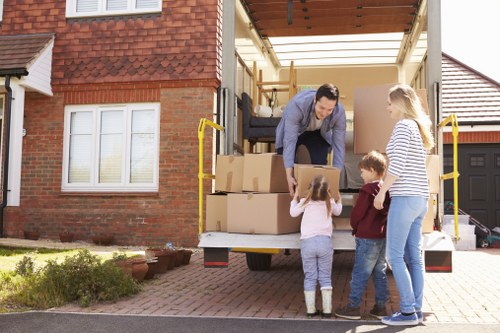 Removal van and packed boxes outside a Barnet home