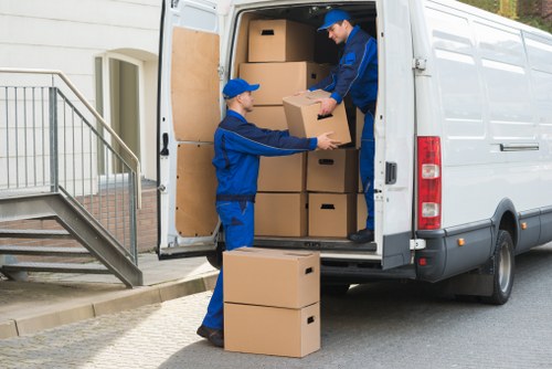 Professional home moving support for Barnet residents with packed boxes and a moving van